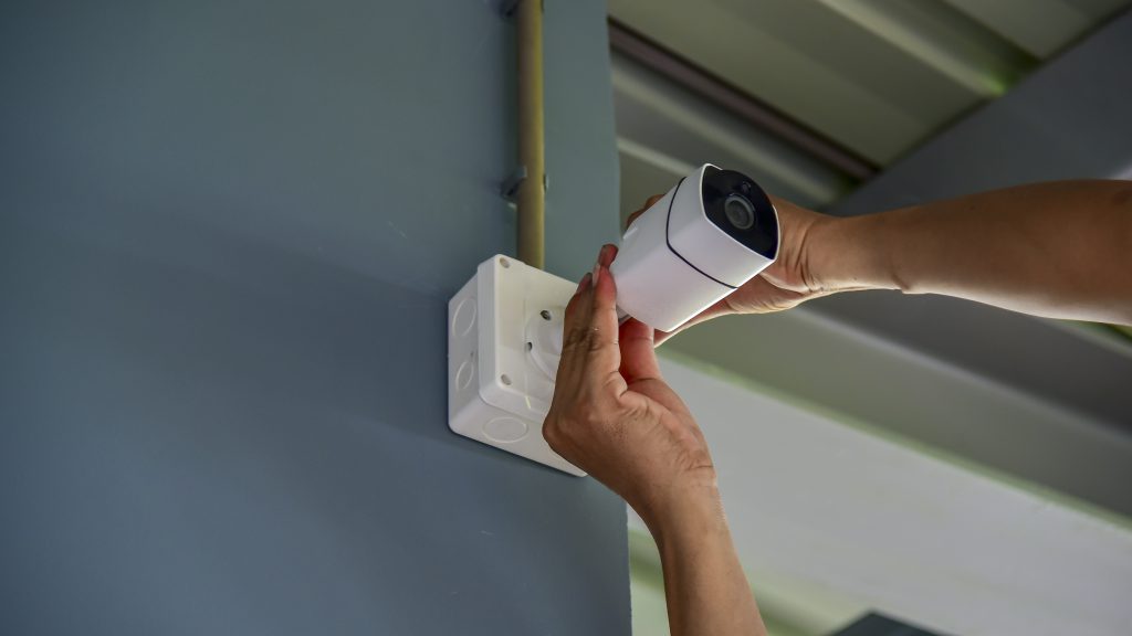 Teachnician installing CCTV camera System for security area.